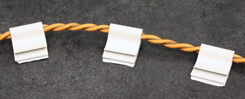 J-clips and conductive fluid sensing cable Use j-clips to secure a cable installation